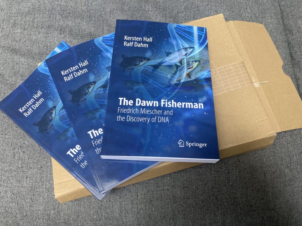 Copies of 'The Dawn Fisherman' the new book by Kersten Hall and Ralf Dahm, published by SpringerNature about Friedrich Miescher's discovery of DNA